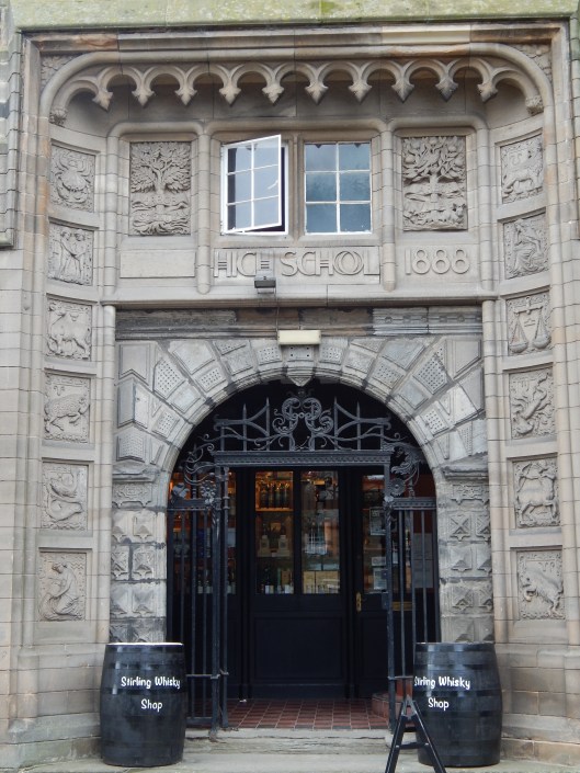 16th century portal on late 19th century building.  Carvings around the door are the signs of the zodiac.