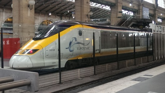 Eurostar behind glass.  Britain is not part of the European open borders Schengen Agreement, so there is an isolated international zone in the station in Paris